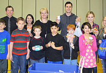 Bachelor Helps Distribute Boomerang Backpacks At Harrison