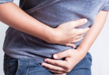 Is holding in your poop at work bad for your health?