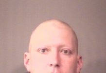 Man arrested after hitting woman in front of her young daughter