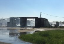 Two firefighters in hospital after Elkhart building goes up in flames