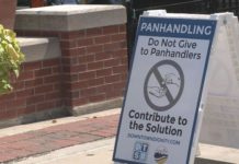 Downtown South Bend signs tell people not to give to panhandlers