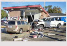 Truck runs off road into building in Warsaw