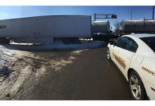 Train clips semi in New Paris