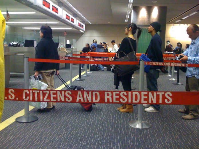 Immigration-Line-696x522