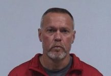 Elkhart Police officer behind bars on suspicion of residential entry, harassment
