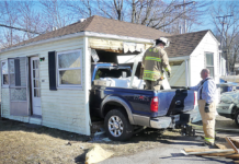 Passenger injured when pickup truck hits Warsaw home