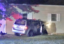 Woman Injured after SUV Hits a House
