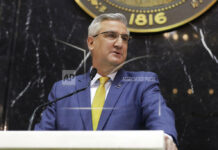 Indiana governor says again wait a year on teacher pay boost