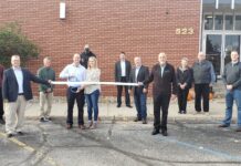 Veritas, K21 hold ribbon cuttings