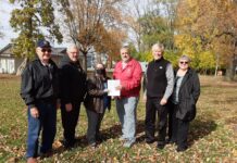 Salvation Army donates lot, deed to Habitat for Humanity