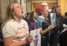 Holcomb signs transgender medical care ban, ACLU quickly files suit