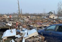 Holcomb declares disaster; views tornado damage