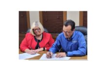 Cardinal Services gifts Jomac building to Fellowship Missions