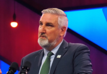 Holcomb headed to Australia