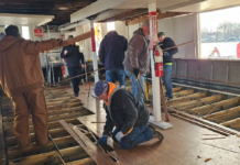 Volunteers quickly remove lower floor of the Dixie Sternwheeler