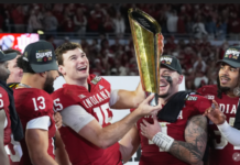 Indiana completes undefeated season and wins first national football title, beating Miami 27-21
