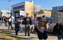 Counter-protester accused of assaulting adult woman at student protest in Warsaw High school protester walk along Center Street in Warsaw Friday afternoon after they walked out of class early in protest over the federal immigration crackdown. News Now Warsaw photo by Dan Spalding.