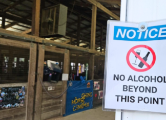 With arrival of alcohol sales at county fair, 4-H places signs near related activities